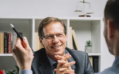 Lawyer meeting a client in his office