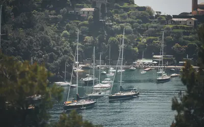 Sailboats moored in a Mediterranean bay